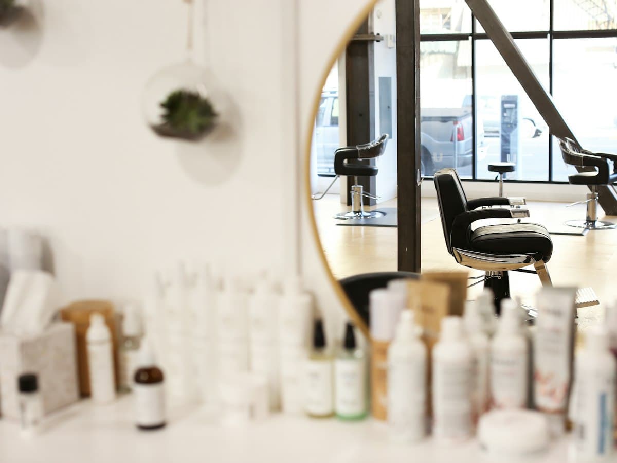 Bright beauty salon interior with styling chairs